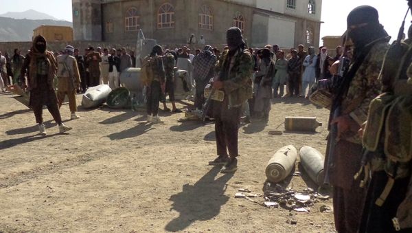 In this photograph taken on October 13, 2015, Afghan Taliban militants gather around parts of a US F-16 aircraft that was struck over in Sayid Karam district of eastern Paktia province In this photograph taken on October 13, 2015, Afghan Taliban militants gather around parts of a US F-16 aircraft that was struck over in Sayid Karam district of eastern Paktia province - Sputnik International