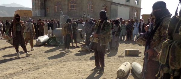 In this photograph taken on October 13, 2015, Afghan Taliban militants gather around parts of a US F-16 aircraft that was struck over in Sayid Karam district of eastern Paktia province In this photograph taken on October 13, 2015, Afghan Taliban militants gather around parts of a US F-16 aircraft that was struck over in Sayid Karam district of eastern Paktia province - Sputnik International