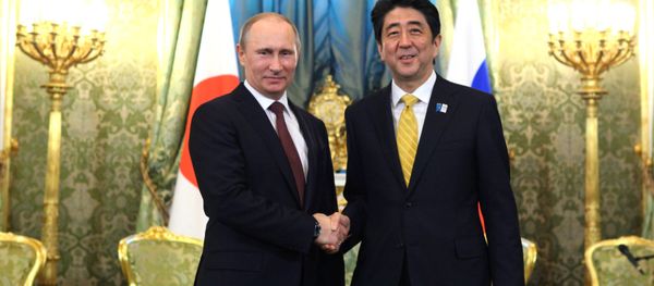 Russian President Vladimir Putin and Prime Minister of Japan Shinzo Abe shake hands prior to their talks in the Kremlin, April 29, 2013 Russian President Vladimir Putin and Prime Minister of Japan Shinzo Abe shake hands prior to their talks in the Kremlin, April 29, 2013 - Sputnik International