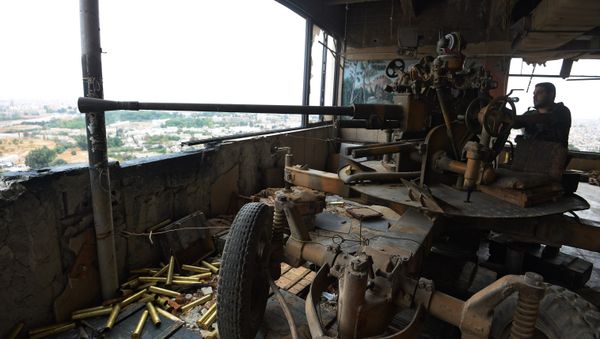 A soldier of the Syrian Arab Army is at an observation post facing the Jobar district occupied by terrorists A soldier of the Syrian Arab Army is at an observation post facing the Jobar district occupied by terrorists - Sputnik International