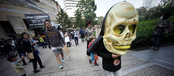 A child wearing a big skull participates a Halloween costume festival in Tokyo, Saturday, Oct. 25, 2014 A child wearing a big skull participates a Halloween costume festival in Tokyo, Saturday, Oct. 25, 2014 - Sputnik International