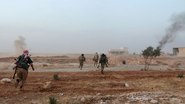 A picture taken on October 17, 2015 shows smoke billowing as Syrian opposition fighters run in the Mount Azzan area, 24 kms from the northern Syrian city of Aleppo, during reported fighting against forces loyal to Syrian President Bashar al-Assad - Sputnik International