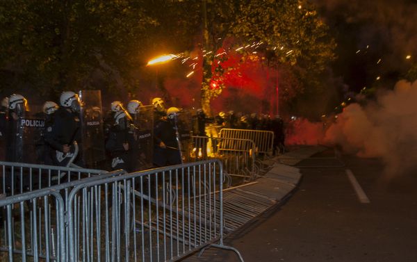 Demonstrators throw flares at police during protests in front of the parliament building in Podgorica, Montenegro, October 24, 2015. - Sputnik International