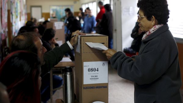 A woman casts her vote at a polling station in Buenos Aires A woman casts her vote at a polling station in Buenos Aires - Sputnik International