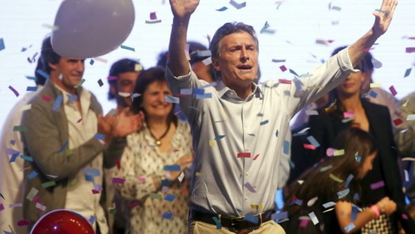 Mauricio Macri, presidential candidate of Cambiemos (Let's Change) coalition waves to his supporters after election in Buenos Aires, Argentina, October 25, 2015. - Sputnik International