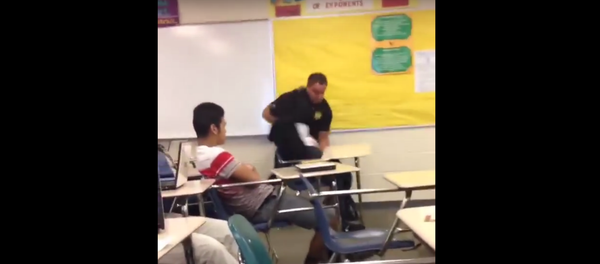 A cop fights a student at Spring Valley High School. A cop fights a student at Spring Valley High School. - Sputnik International