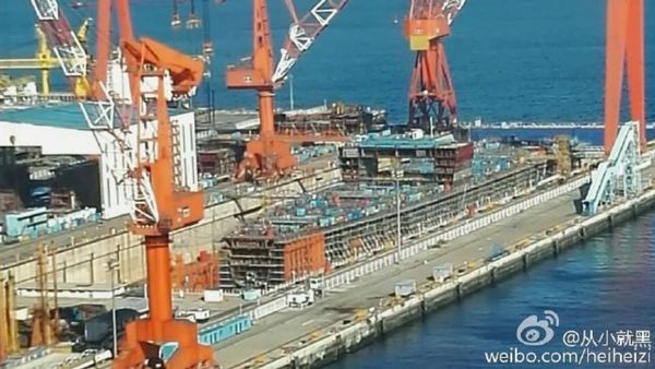 This hull under construction at Dalian Shipyard could be China's first indigenous aircraft carrier. - Sputnik International