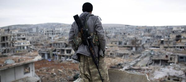 FILE - In this Jan. 30, 2015, file photo, a Syrian Kurdish sniper looks at the rubble in the Syrian city of Ain al-Arab, also known as Koban FILE - In this Jan. 30, 2015, file photo, a Syrian Kurdish sniper looks at the rubble in the Syrian city of Ain al-Arab, also known as Koban - Sputnik International
