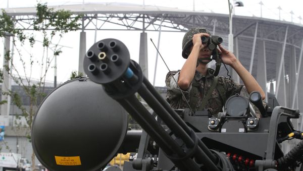A South Korean army soldier uses a pair of binoculars during an anti-terror drill ahead of the 2014 Incheon Asian Games outside of Incheon Asiad Main Stadium in Incheon, South Korea, Wednesday, Aug. 6, 2014 A South Korean army soldier uses a pair of binoculars during an anti-terror drill ahead of the 2014 Incheon Asian Games outside of Incheon Asiad Main Stadium in Incheon, South Korea, Wednesday, Aug. 6, 2014 - Sputnik International