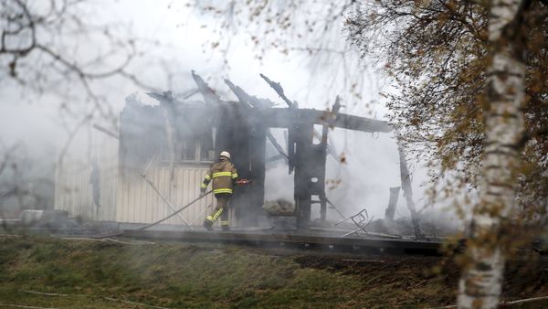 FILE - A Tuesday, Oct. 20, 2015 photo from files showing a firefighter working in the smoking remains of an accommodation home for asylum seekers near Munkedal in western Sweden FILE - A Tuesday, Oct. 20, 2015 photo from files showing a firefighter working in the smoking remains of an accommodation home for asylum seekers near Munkedal in western Sweden - Sputnik International