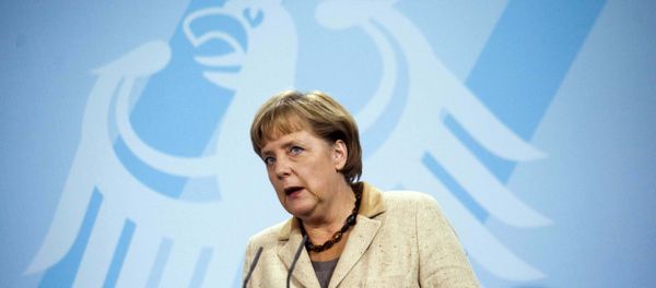 German Chancellor Angela Merkel in front of Germany's heraldic eagle German Chancellor Angela Merkel in front of Germany's heraldic eagle - Sputnik International
