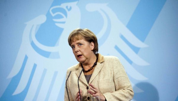 German Chancellor Angela Merkel in front of Germany's heraldic eagle German Chancellor Angela Merkel in front of Germany's heraldic eagle - Sputnik International