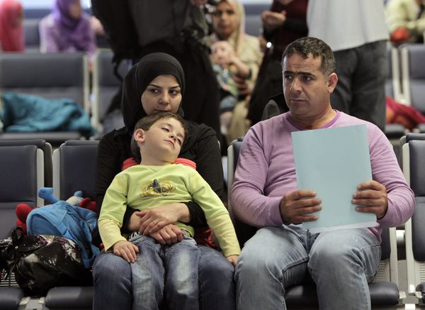 Syrian refugees wait to board a flight to Germany for temporary relocation, at Rafik Hariri International Airport in Beirut, Lebanon, Wednesday, Sept. 11, 2013. Syrian refugees wait to board a flight to Germany for temporary relocation, at Rafik Hariri International Airport in Beirut, Lebanon, Wednesday, Sept. 11, 2013. - Sputnik International