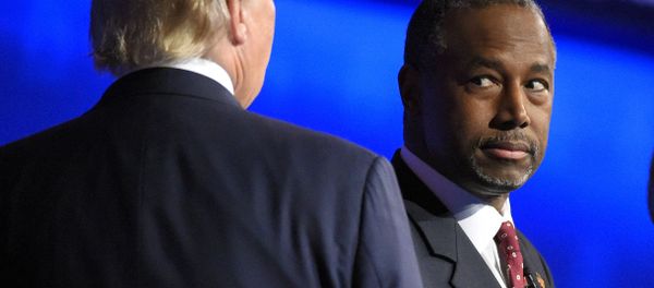 Ben Carson watches as Donald Trump takes the stage during the CNBC Republican presidential debate at the University of Colorado. Ben Carson watches as Donald Trump takes the stage during the CNBC Republican presidential debate at the University of Colorado. - Sputnik International