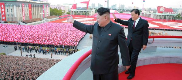 North Korean leader Kim Jong Un (L) and senior Chinese Communist Party official Liu Yunshan (R) wave during celebration of the 70th anniversary of the founding of the ruling Workers' Party of Korea, in this undated photo released by North Korea's Korean Central News Agency (KCNA) in Pyongyang on October 12, 2015 North Korean leader Kim Jong Un (L) and senior Chinese Communist Party official Liu Yunshan (R) wave during celebration of the 70th anniversary of the founding of the ruling Workers' Party of Korea, in this undated photo released by North Korea's Korean Central News Agency (KCNA) in Pyongyang on October 12, 2015 - Sputnik International