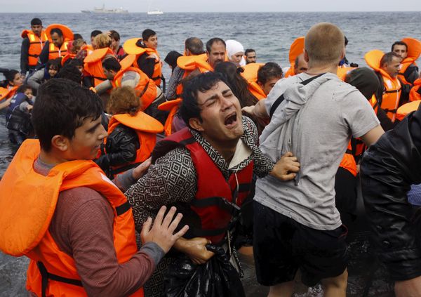 A Syrian refugee cries while disembarking from a flooded raft at a beach on the Greek island of Lesbos, after crossing a part of the Aegean Sea from the Turkish coast on an overcrowded raft, October 20, 2015 A Syrian refugee cries while disembarking from a flooded raft at a beach on the Greek island of Lesbos, after crossing a part of the Aegean Sea from the Turkish coast on an overcrowded raft, October 20, 2015 - Sputnik International