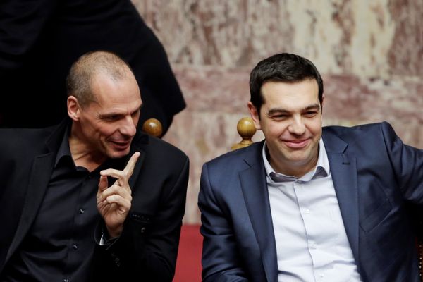 Greece's Prime Minister Alexis Tsipras, right, and Finance Minister Yanis Varoufakis chat during a Presidential vote in Athens, on Wednesday, Feb. 18, 2015. - Sputnik International