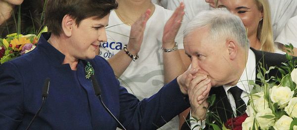 Conservative Law and Justice leader Jaroslaw Kaczynski kisses hand Justice candidate for the Prime Minister Beata Szydlo, left, at the party's headquarters in Warsaw, Poland, on Sunday, Oct.25, 2015 Conservative Law and Justice leader Jaroslaw Kaczynski kisses hand Justice candidate for the Prime Minister Beata Szydlo, left, at the party's headquarters in Warsaw, Poland, on Sunday, Oct.25, 2015 - Sputnik International