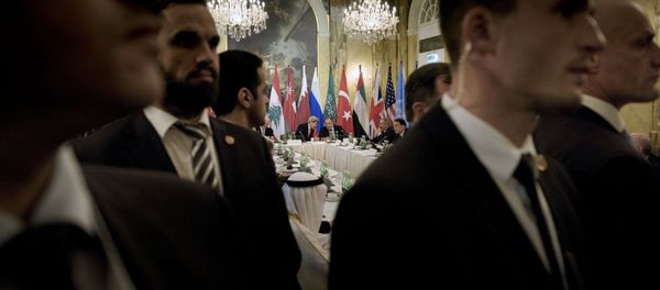 Security staff stand as US Secretary of State John Kerry (back L) and Russian Foreign Minister Sergei Lavrov (back 2nd L) chat before a meeting with 17 nations, the European Union and United Nations at the Hotel Imperial in Vienna, October 30, 2015 Security staff stand as US Secretary of State John Kerry (back L) and Russian Foreign Minister Sergei Lavrov (back 2nd L) chat before a meeting with 17 nations, the European Union and United Nations at the Hotel Imperial in Vienna, October 30, 2015 - Sputnik International