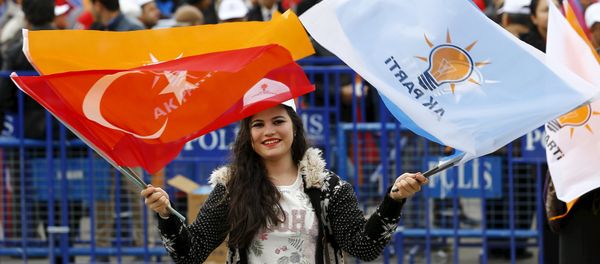 A supporter of the ruling AK Party waves national and party flags during an election rally in Ankara, Turkey, October 31, 2015 A supporter of the ruling AK Party waves national and party flags during an election rally in Ankara, Turkey, October 31, 2015 - Sputnik International