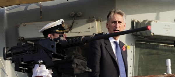 Former British Foreign Secretary Philip Hammond boards a British military ship docked in Manama, Bahrain after helping lay a cornerstone for a new British military base being built in Bahrain, Saturday, Oct. 31, 2015. Britain hasn't had a permanent military base in Bahrain since its former colony declared independence from Britain in 1971, though close ties have continued. Former British Foreign Secretary Philip Hammond boards a British military ship docked in Manama, Bahrain after helping lay a cornerstone for a new British military base being built in Bahrain, Saturday, Oct. 31, 2015. Britain hasn't had a permanent military base in Bahrain since its former colony declared independence from Britain in 1971, though close ties have continued. - Sputnik International
