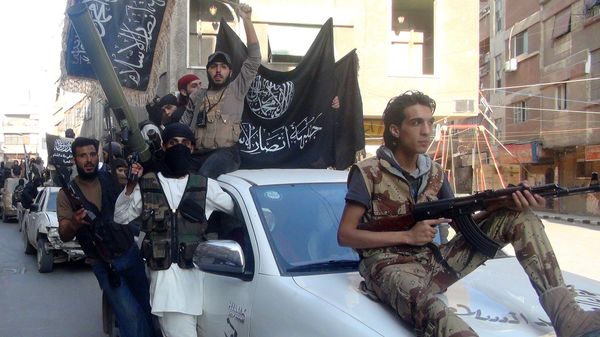 Islamic fighters from the al-Qaeda group in the Levant, Al-Nusra Front, wave their movement's flag as they parade at the Yarmuk Palestinian refugee camp, south of Damascus, to denounce Israel’s military offensive on the Gaza Strip, on July 28, 2014. Islamic fighters from the al-Qaeda group in the Levant, Al-Nusra Front, wave their movement's flag as they parade at the Yarmuk Palestinian refugee camp, south of Damascus, to denounce Israel’s military offensive on the Gaza Strip, on July 28, 2014. - Sputnik International