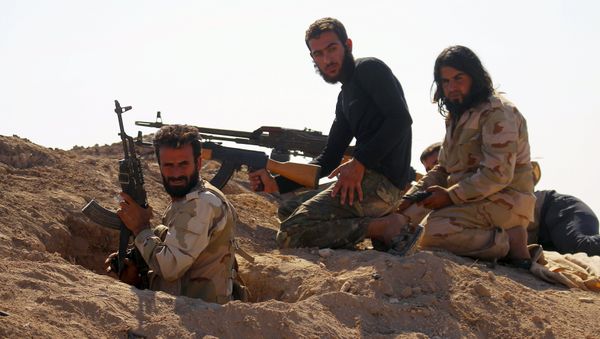 Rebel fighters carry their weapons as they take positions in the town of Kafr Nabudah, in Hama province, Syria, on which forces loyal to Syria's President Bashar al-Assad are carrying out offensives to take control of the town, October 11, 2015 - Sputnik International