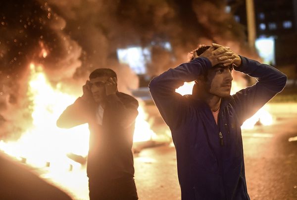 People react as smoke billows from burning pallets set on fire during clashes between Turkish riot policemen and Kurdish protesters in the southeastern city of Diyarbakir on November 1, 2015 after first results of the Turkish general election showed a clear victory to the Justice and Development Party (AKP). Turkish police fired tear gas and water cannon at Kurds who were protesting after the election appeared to deliver a clear victory to AKP, an AFP photographer said. Latest results say the pro-Kurdish People's Democratic Party (HDP) won slightly over 10 percent of the vote, just enough to scrape into parliament. People react as smoke billows from burning pallets set on fire during clashes between Turkish riot policemen and Kurdish protesters in the southeastern city of Diyarbakir on November 1, 2015 after first results of the Turkish general election showed a clear victory to the Justice and Development Party (AKP). Turkish police fired tear gas and water cannon at Kurds who were protesting after the election appeared to deliver a clear victory to AKP, an AFP photographer said. Latest results say the pro-Kurdish People's Democratic Party (HDP) won slightly over 10 percent of the vote, just enough to scrape into parliament. - Sputnik International