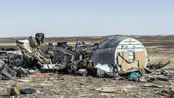 Debris belonging to the A321 Russian airliner are seen at the site of the crash in Wadi el-Zolmat, a mountainous area in Egypt's Sinai Peninsula on November 1, 2015. International investigators began probing why a Russian airliner carrying 224 people crashed in Egypt's Sinai Peninsula, killing everyone on board, as rescue workers widened their search for missing victims. - Sputnik International