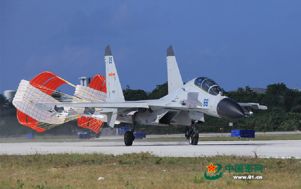 A J-11 fighter taxis on the runway after returning from a flight training on Oct. 30, 2015. An aviation division under the South China Sea Fleet of the Chinese PLA Navy carried out on Friday training on real air battle tactics. A J-11 fighter taxis on the runway after returning from a flight training on Oct. 30, 2015. An aviation division under the South China Sea Fleet of the Chinese PLA Navy carried out on Friday training on real air battle tactics. - Sputnik International