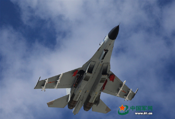 A J-11 fighter flies above the South China Sea on Oct. 30, 2015. An aviation division under the South China Sea Fleet of the Chinese PLA Navy carried out on Friday training on real air battle tactics.  - Sputnik International