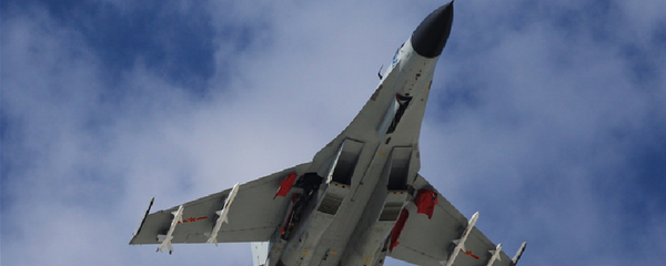 A J-11 fighter flies above the South China Sea on Oct. 30, 2015. An aviation division under the South China Sea Fleet of the Chinese PLA Navy carried out on Friday training on real air battle tactics. A J-11 fighter flies above the South China Sea on Oct. 30, 2015. An aviation division under the South China Sea Fleet of the Chinese PLA Navy carried out on Friday training on real air battle tactics. - Sputnik International