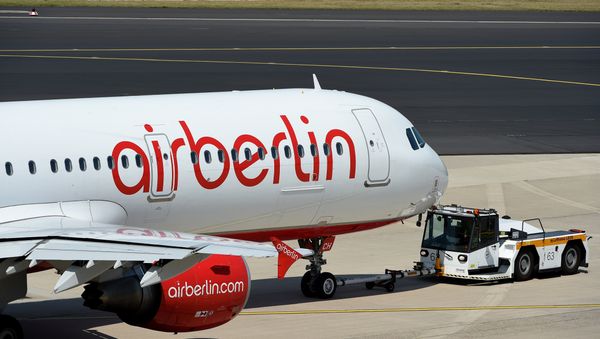 A photo taken on August 3, 2015 shows an Airbus of German airline Air Berlin on the runway in Duesseldorf, western Germany. A photo taken on August 3, 2015 shows an Airbus of German airline Air Berlin on the runway in Duesseldorf, western Germany. - Sputnik International
