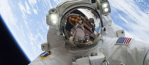 Astronaut Mike Hopkins, Expedition 38 Flight Engineer, is shown in this handout photo provided by NASA as he participates in the second of two spacewalks which took place on December 24, 2013 Astronaut Mike Hopkins, Expedition 38 Flight Engineer, is shown in this handout photo provided by NASA as he participates in the second of two spacewalks which took place on December 24, 2013 - Sputnik International