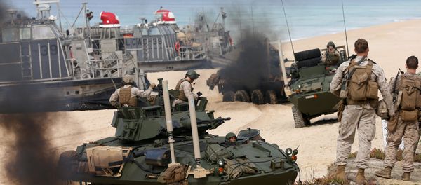 US marine armoured vehicles steers through the soft sand after getting off from a US Navy hovercraft during the NATO Trident Juncture exercise 2015 at Raposa Media beach in Pinheiro da Cruz, south of Lisbon, Tuesday, Oct. 20, 2015. - Sputnik International