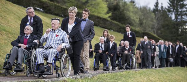 Holocaust survivors and French President Francois Hollande with a European delegation walk during their visit to the former Nazi concentration camp in Natzwiller-Struthof, eastern France, on Sunday April 26 2015. Holocaust survivors and French President Francois Hollande with a European delegation walk during their visit to the former Nazi concentration camp in Natzwiller-Struthof, eastern France, on Sunday April 26 2015. - Sputnik International