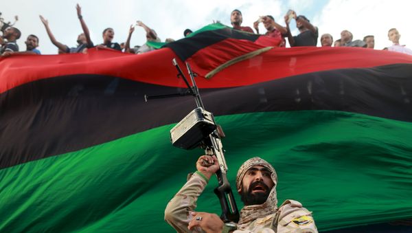 One of the members of the military protecting a demonstration against candidates for a national unity government proposed by U.N. envoy for Libya Bernardino Leon, is pictured in Benghazi, Libya October 23, 2015. One of the members of the military protecting a demonstration against candidates for a national unity government proposed by U.N. envoy for Libya Bernardino Leon, is pictured in Benghazi, Libya October 23, 2015. - Sputnik International