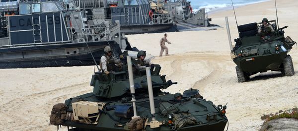 US marines disembark their armoured vehicles from the overcrafts deploid by the USS Arlington amphibious transport dock during the NATO's Trident Juncture exercise at Pinheiro da Cruz beach, south of Lisbon, near Grandola on October 20, 2015 US marines disembark their armoured vehicles from the overcrafts deploid by the USS Arlington amphibious transport dock during the NATO's Trident Juncture exercise at Pinheiro da Cruz beach, south of Lisbon, near Grandola on October 20, 2015 - Sputnik International