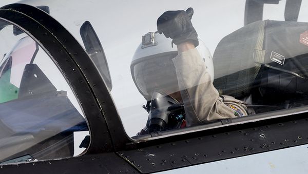 A pilot of a Sukhoi Su-30 fighter jet gestures before taking off at the Hmeymim air base near Latakia, Syria - Sputnik International