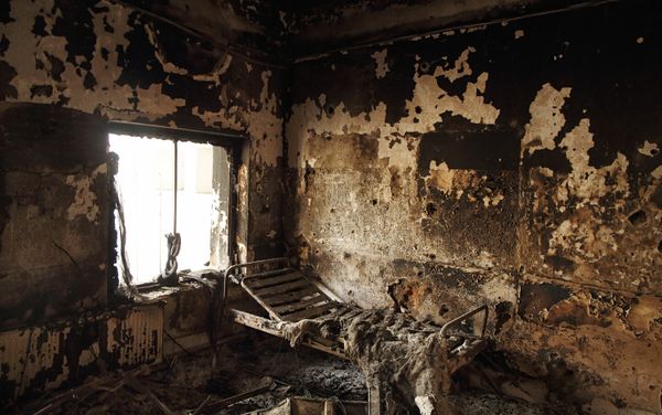The remains of a bed frame in a room on eastern wing of the main Outpatient Department building The remains of a bed frame in a room on eastern wing of the main Outpatient Department building - Sputnik International