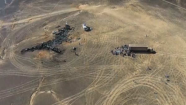 A view from a drone at the Russian Emergencies Ministry camp by the crash site of the Russian Airbus A321 (owned by Kogalymavia) that performed flight 9268 from Sharm el-Sheikh to St Petersburg. The crash site is 100 km away from El Arish in the north of the Sinai Peninsula. Best possible quality. (Freeze frame) - Sputnik International