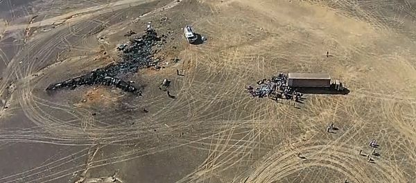A view from a drone at the Russian Emergencies Ministry camp by the crash site of the Russian Airbus A321 (owned by Kogalymavia) that performed flight 9268 from Sharm el-Sheikh to St Petersburg. The crash site is 100 km away from El Arish in the north of the Sinai Peninsula. Best possible quality. (Freeze frame) - Sputnik International
