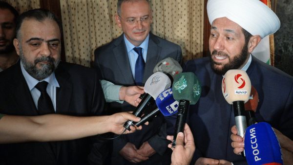 From right: the Grand Mufti of Syria, Ahmad Badreddin Hassoun; the extraordinary and plenipotentiary Russian ambassador in the Syrian Arab Republic, Alexander Kinshchak; the Minister of Awqaf, Mohammad Abdul Sattar al-Sayyed, during a meeting at the Russian embassy in Syria - Sputnik International