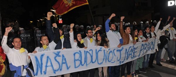 Montenegrin anti-government protesters carry a banner reading, Our future, our right during a protest in the capital Podgorica on October 24, 2015 Montenegrin anti-government protesters carry a banner reading, Our future, our right during a protest in the capital Podgorica on October 24, 2015 - Sputnik International