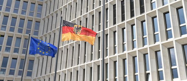 The German (R) and the European flag fly in the wind outside the new Federal Ministry of the Interior building in Berlin on April 26, 2015 - Sputnik International