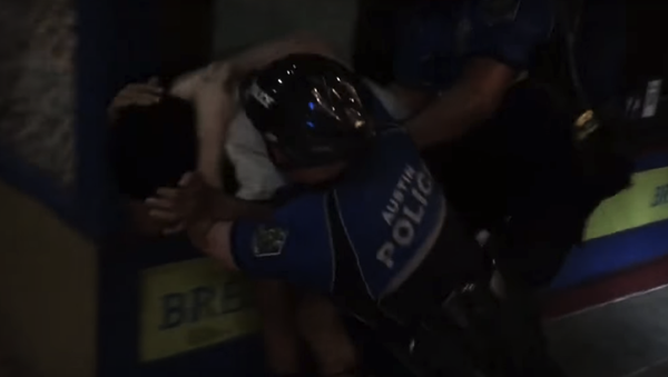Screenshot of video capturing Austin police officers detaining a man for jaywalking - Sputnik International
