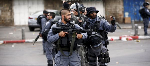 Israeli policemen secure the area where a Palestinian stabbed two Israeli Jews before he was shot dead outside Jerusalem's Old City Israeli policemen secure the area where a Palestinian stabbed two Israeli Jews before he was shot dead outside Jerusalem's Old City - Sputnik International