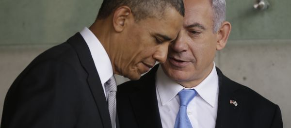 In this Friday, March 22, 2013 file photo, U.S. President Barack Obama, left, listens to Israeli Prime Minister Benjamin Netanyahu during their visit to the Children's Memorial at the Yad Vashem Holocaust memorial in Jerusalem In this Friday, March 22, 2013 file photo, U.S. President Barack Obama, left, listens to Israeli Prime Minister Benjamin Netanyahu during their visit to the Children's Memorial at the Yad Vashem Holocaust memorial in Jerusalem - Sputnik International