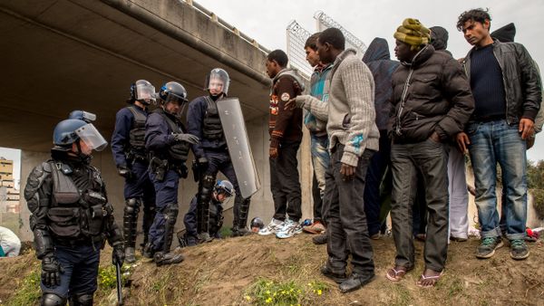 French police officers proceed with operations during the eviction of migrants from a camp site in Calais, northern France, on September 21, 2015 French police officers proceed with operations during the eviction of migrants from a camp site in Calais, northern France, on September 21, 2015 - Sputnik International