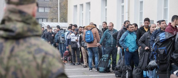 Asylum seekers queue up as they arrive at a refugee reception centre in the northern town of Tornio, Finland, on Friday Sept. 25, 2015 Asylum seekers queue up as they arrive at a refugee reception centre in the northern town of Tornio, Finland, on Friday Sept. 25, 2015 - Sputnik International